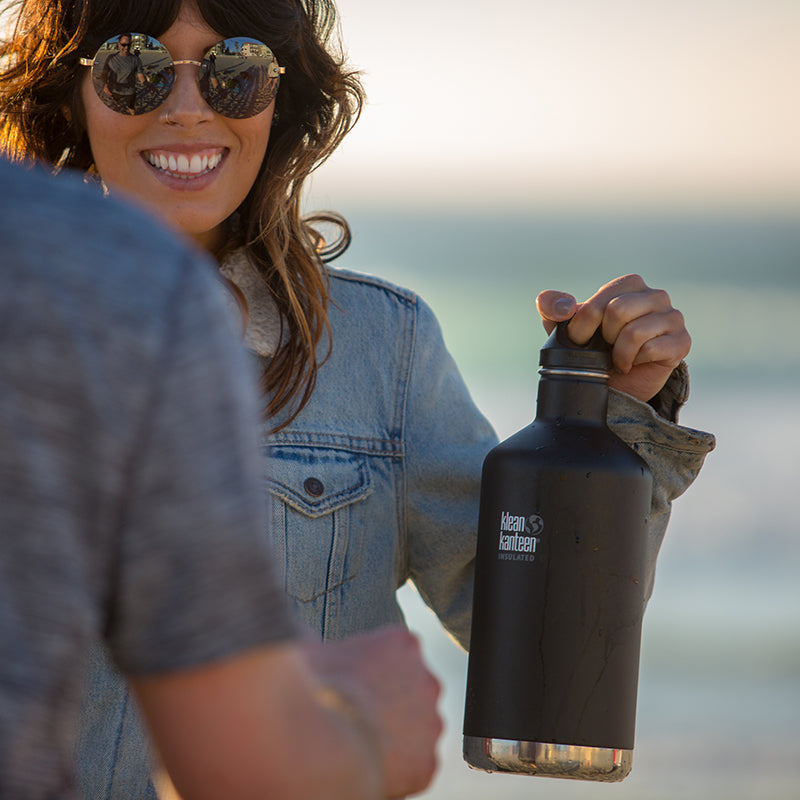 64oz-classic-with-loop-cap-b3 64oz_insulated_classic_black_beach_girl_hand_square.jpg
